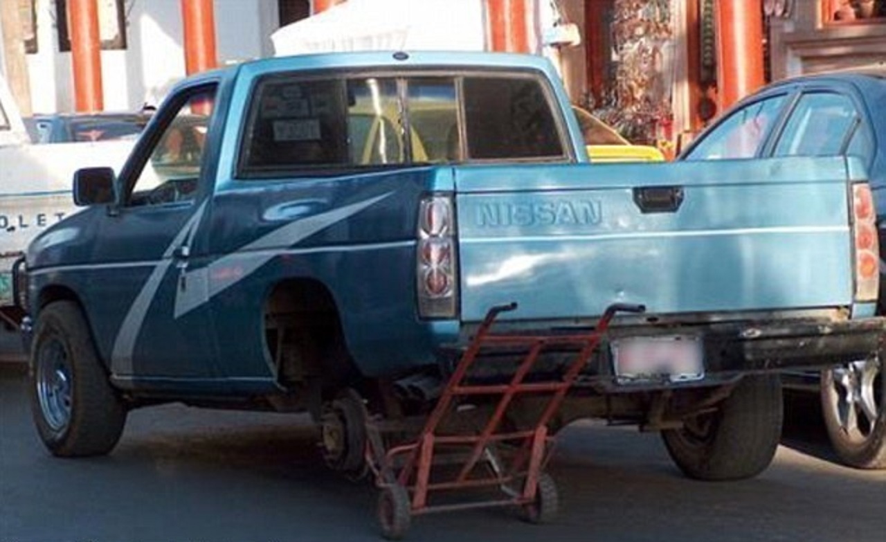 nissan truck with funny tire dolly modication