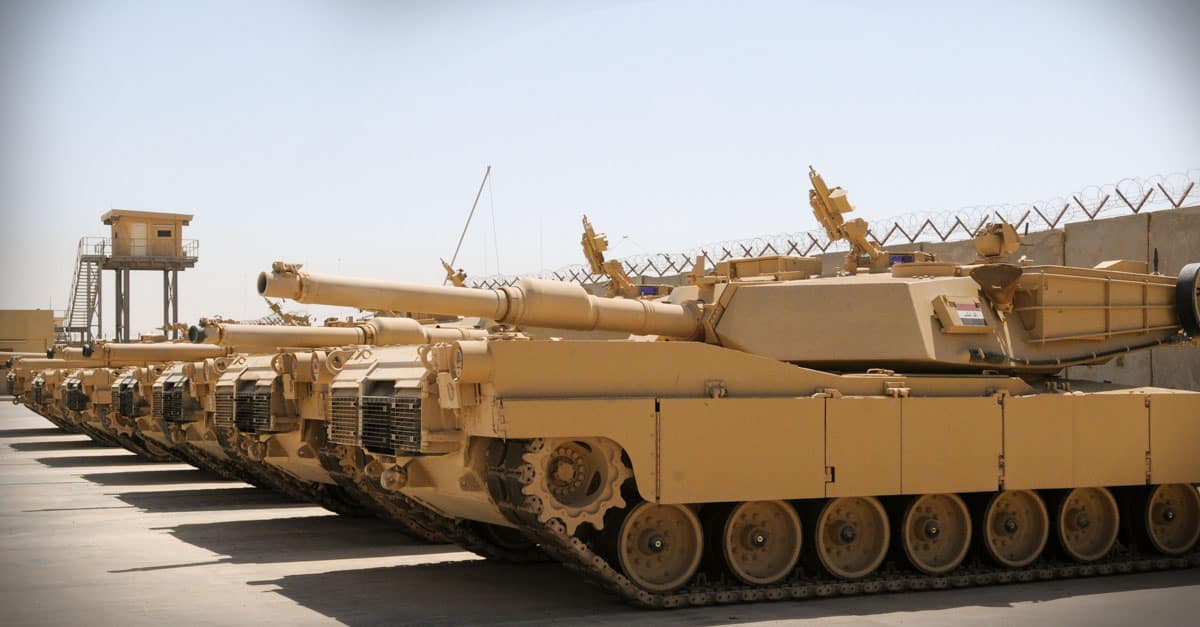 M1 Abrams - M1A1 Abrams tanks sit parked at a secured compound