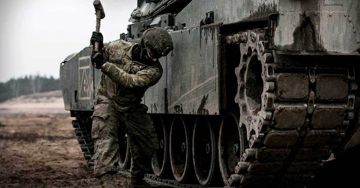 M1 Abrams- Pvt. Gabriel Colon performs maintenance on a M1 Abrams tank 