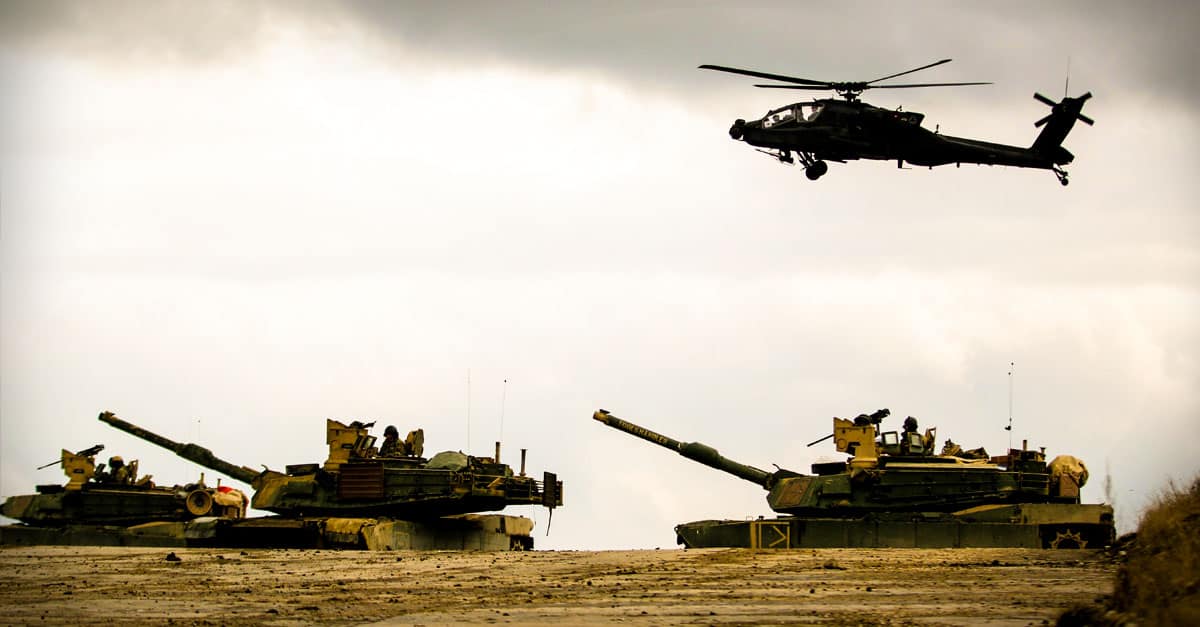 M1 Abrams - tanks and helicopter secure an area during a combined arms live fire exercise 