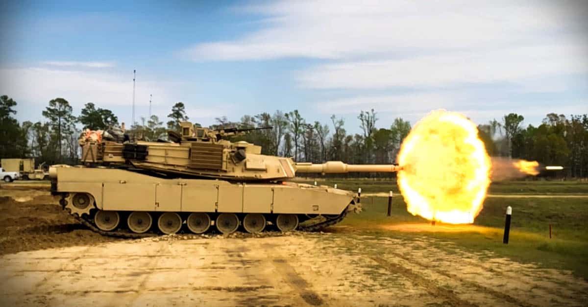 M1 Abrams- troopers re their main gun round at a target during unit gunnery